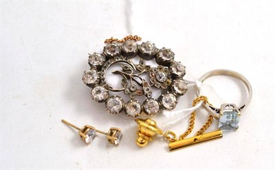 Lot 254 - A paste brooch, an aquamarine ring, a pair of earrings and a tie pin
