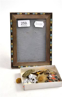 Lot 259 - A silver and enamel photograph frame, a small silver coffee spoon, an agate plaid brooch, seven...