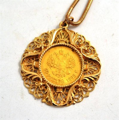 Lot 262 - A 9ct gold pendant inset with a Russian coin, on a snake link chain stamped '9CT''
