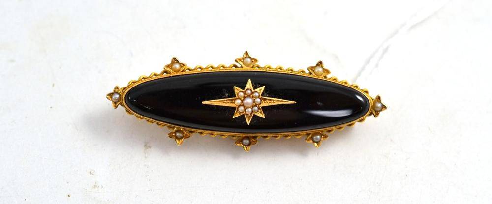 Lot 263 - A Victorian onyx and seed pearl brooch