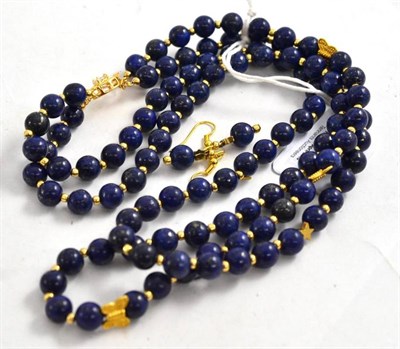 Lot 276 - A two row lapis lazuli necklace and a pair of drop earrings