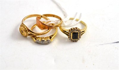 Lot 280 - 18ct gold three stone diamond ring and three others