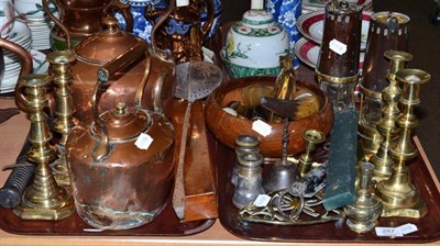 Lot 287 - Two trays of brass and copper, including two copper kettles, two pairs of brass candlesticks,...