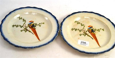 Lot 298 - A pair of Pratt ware plates, decorated with birds and blue feathered edges