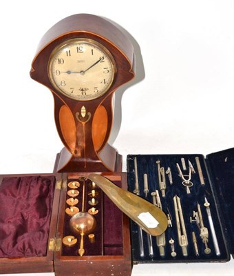 Lot 305 - An Art Nouveau mahogany cased Smith's electric mantel timepiece, a Sikes Hydrometer in a...