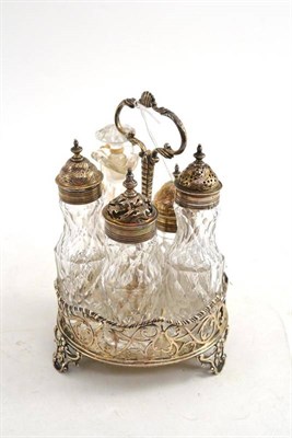 Lot 336 - An early George III silver five bottle cruet with cut glass bottles, the stand on five shell...