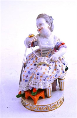 Lot 341 - A Meissen figure of a seated girl