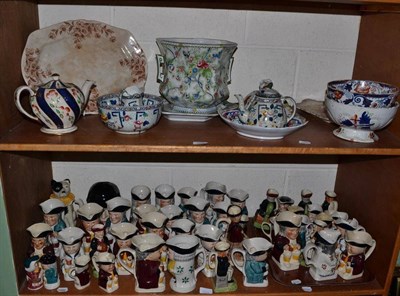 Lot 364 - Two shelves of ceramics including toby jugs and tea pots, Royal Corona ware jardiniere and...