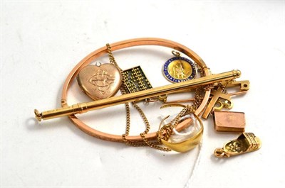 Lot 375 - A 9ct gold bangle, four charms, a cross on chain, a pencil, a bar brooch, a locket and a gold...