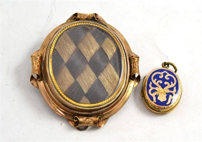 Lot 390 - A Victorian mourning brooch and a locket