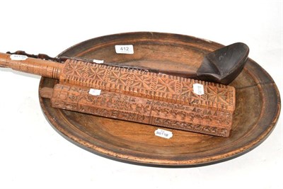 Lot 412 - Chip carved wash bat, chip carved mould, a sycamore platter and a ladle (4)