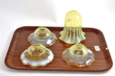 Lot 413 - A set of three vaseline glass shades and another larger shade
