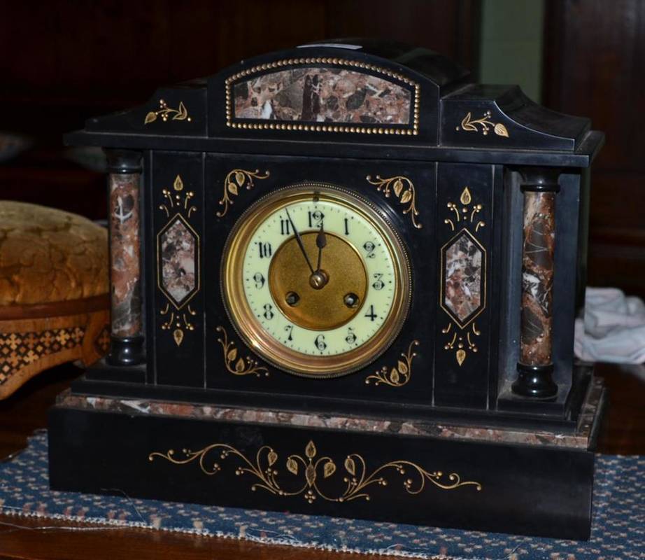 Lot 417 - A Victorian black slate mantel clock with coloured marble pillars