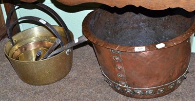 Lot 426 - A riveted copper log bin, two brass preserve pans, three graduated sauce pans and an iron sauce pan