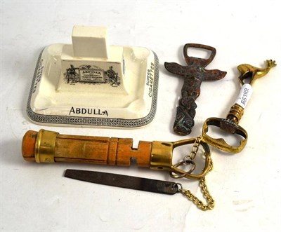 Lot 437 - An Abdullah Cigarette advertising ashtray/matchbox holder, a wood cue tipper (a.f.) and two...