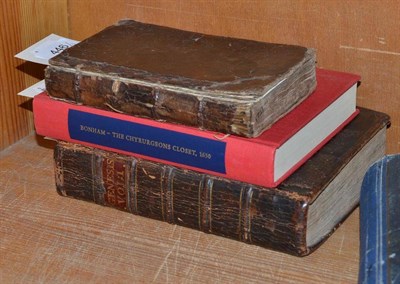 Lot 446 - Three books, ";The Chyrurgeons Closet London 1630"; by Thomas Bonham, ";Vol. 1 On the Book Of...