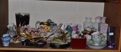 Lot 453 - A shelf of decorative ceramics including porcelain and gilt metal rose spray on marble plinth, cups