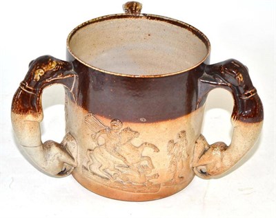 Lot 474 - 19th century stoneware tyg with greyhound handles