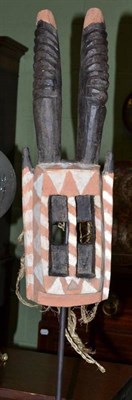 Lot 487 - A Dogon Walu Antelope Mask on a metal display stand, 70cm high overall