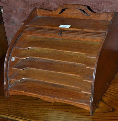 Lot 498 - An early 20th century oak tambour front correspondence rack