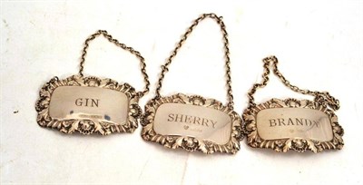 Lot 519 - Three silver decanter labels: Brandy, Gin and Sherry