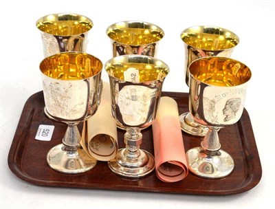 Lot 520 - A set of four silver 'Barker Ellis Beverley' goblets, with certificates; and two Elizabeth II...