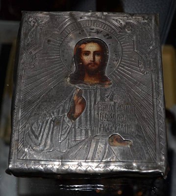 Lot 587 - A Russian pocket icon, 19th century, as Christ Pantocrator with engraved silver oklad, 8.5cm by 7cm