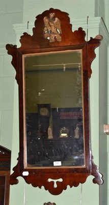 Lot 596 - A George II style mahogany and parcel gilt wall mirror