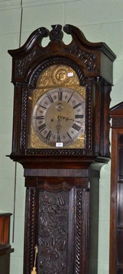 Lot 599 - 19th century foliate carved oak cased longcase clock with arched brass dial