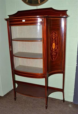 Lot 609 - An Edwardian inlaid mahogany break bow front salon cabinet