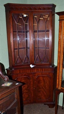 Lot 617 - Reproduction mahogany glazed standing corner cabinet