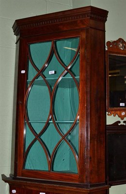 Lot 627 - George III mahogany hanging corner cupboard with glazed door