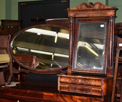 Lot 658 - A Beidermeier mahogany toilet mirror and an oval crutch framed toilet mirror