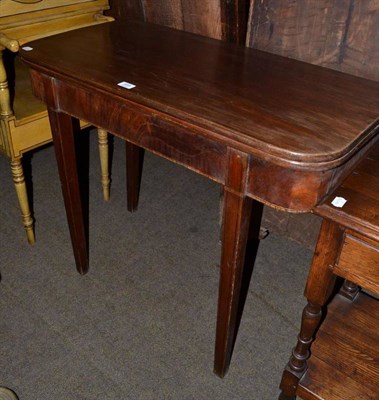 Lot 665 - George III fold over mahogany tea table