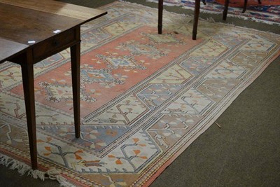 Lot 681 - Melas carpet, West Anatolia, the narrow peach field with a row of five medallions enclosed by...