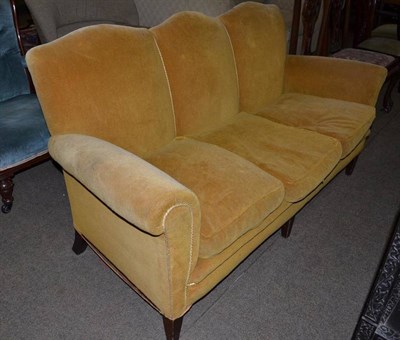 Lot 699 - A gold velour upholstered three seater settee