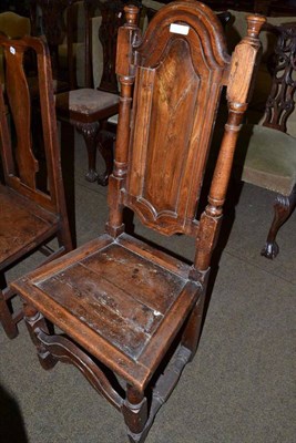 Lot 701 - 17th century elm panel back side chair