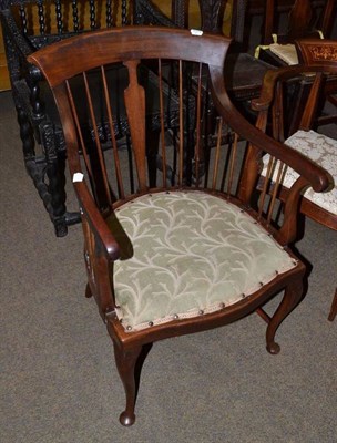 Lot 705 - An Edwardian mahogany tub shaped spindle back armchair