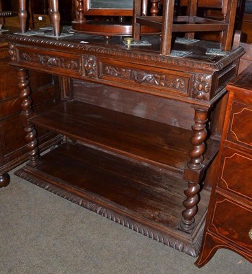 Lot 735 - Late 19th century carved oak three tier buffet fitted with drawers