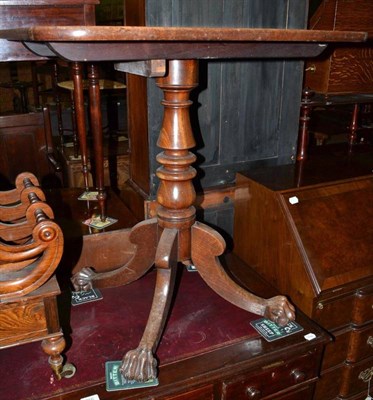 Lot 755 - A George IV mahogany tilt top table on turned column and paw feet