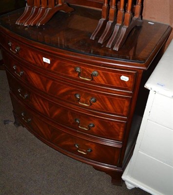 Lot 770 - Reproduction mahogany bow-fronted four height chest of drawers with glass protector