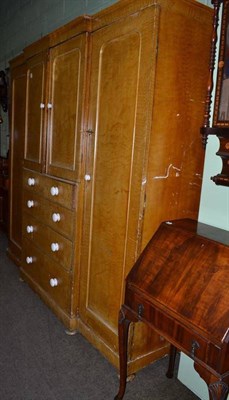 Lot 778 - A Victorian scumbled pine triple wardrobe