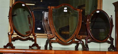 Lot 787 - Three mahogany crutch frame toilet mirrors