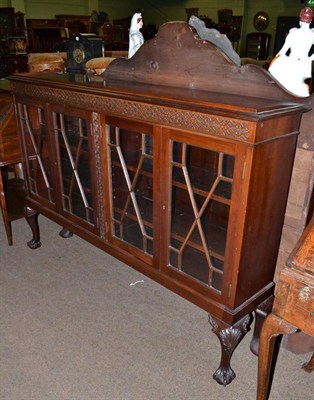 Lot 796 - A glazed mahogany display cabinet on claw and ball feet