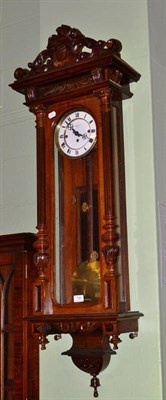 Lot 798 - A walnut Vienna style double weight driven wall clock, the dial signed Grago