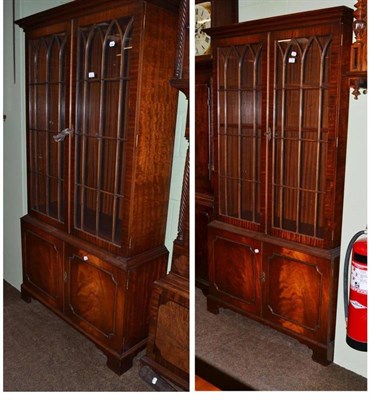 Lot 799 - Pair of reproduction mahogany small bookcases with eight shelves and keys