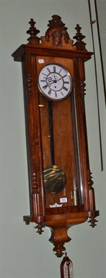 Lot 803 - A walnut Vienna style weight driven wall clock