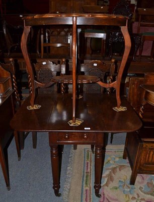 Lot 874 - An Edwardian walnut occasional table and a mahogany Pembroke table