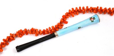 Lot 2 - A coral necklace and an enamelled cigarette holder