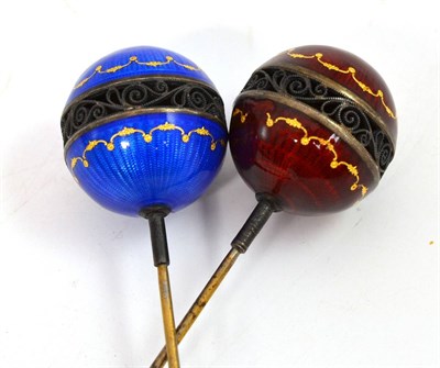 Lot 12 - A pair of mid-19th century guilloche enamel and filigree decorated hat pins with gilt scrolled...